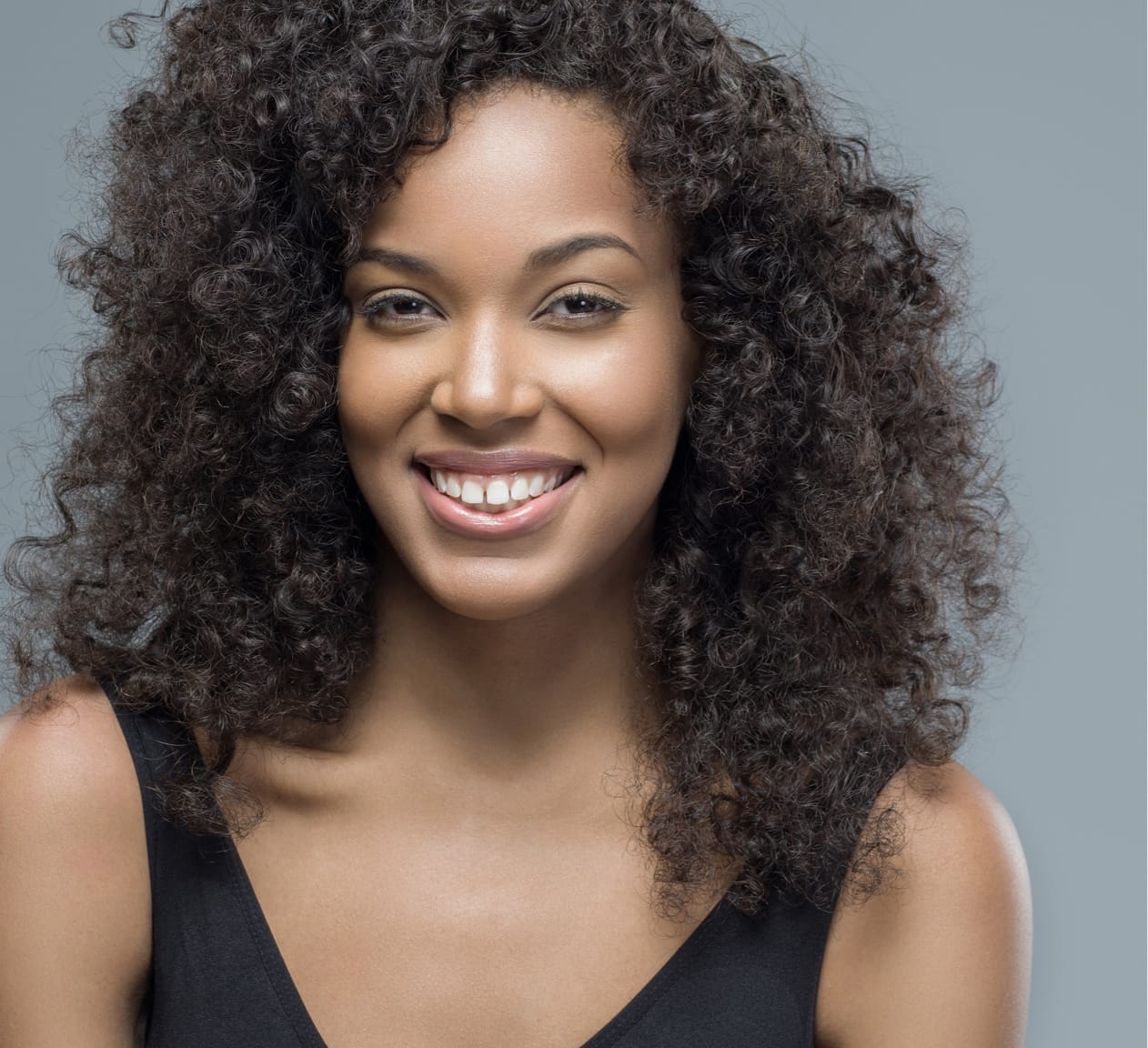 smiling woman with curly hair